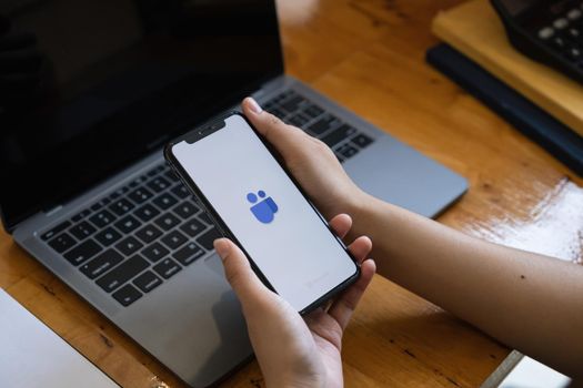 CHIANG MAI, THAILAND - JULY 14, 2021 : A Businessman working from home employee. Microsoft Team is platform that combines persistent chat in the workplace