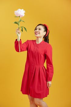 woman holding peony bouquet