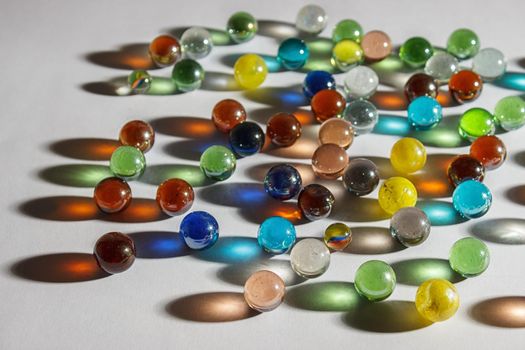 multicolored glass balls on the table indoor closeup