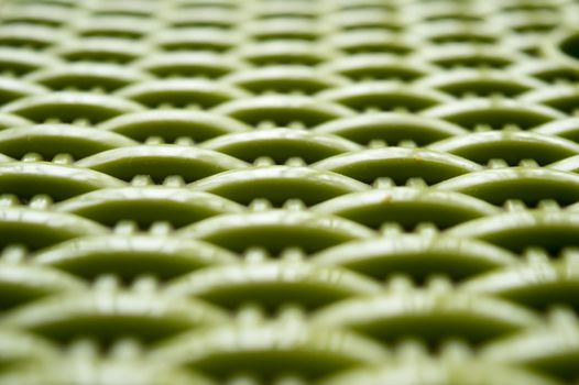 Chinese seamless pattern on green color plastic screen. Close up. Abstracts and backgrounds. Repeat vector knitted Design and pattern element Selective Focus.