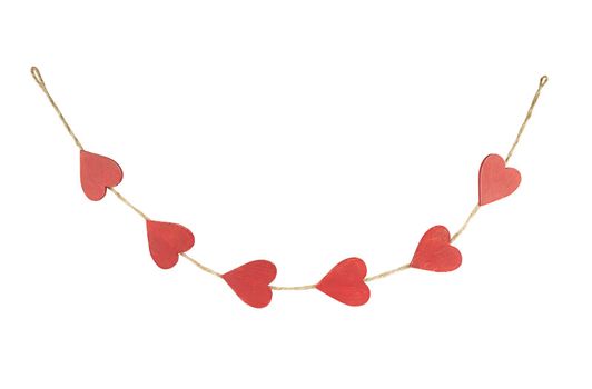 Hanging rustic garland from red wooden hearts isolated on white background.