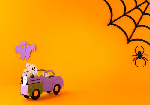 Happy halloween holiday concept. Halloween handmade paper decorations, spiders, spider web, ghosts in car on orange background. Halloween festival party, greeting card mockup with copy space.