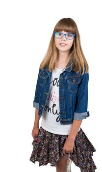 teen girl in glasses and denim jacket on a light background