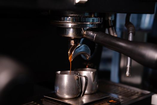 Close-up of Espresso machine making coffee in pub, bar, restaurant. Professional coffee brewing. Coffee Shop Cafeteria Restaurant Service Concept.