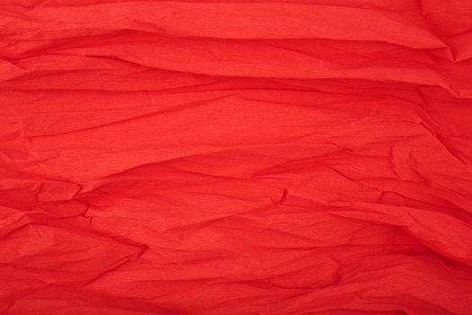 Red crumpled paper texture background with space for text. Crumpled wrapping paper background. Concept of template for text with high resolution