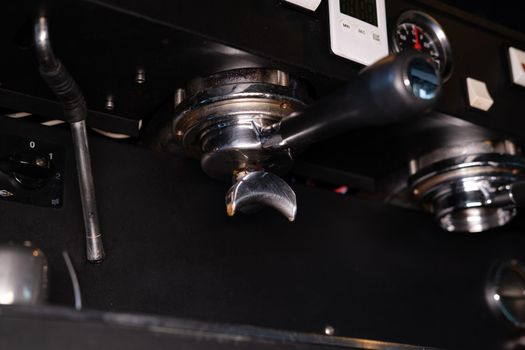 close up of a professional coffee machine. loft dark coffee shop.