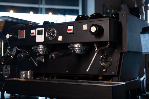 close up of a professional coffee machine. loft dark coffee shop.