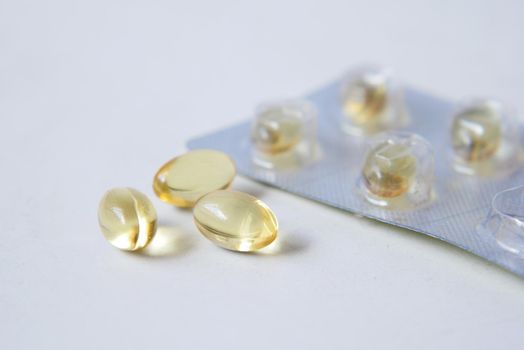 fish oil supplement on white background .
