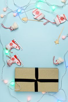 Gift box for Christmas and New Year. Minimal style. Flat flat, top view, copy space. Vertical photo