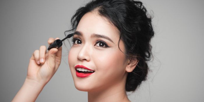 Asian women using mascara