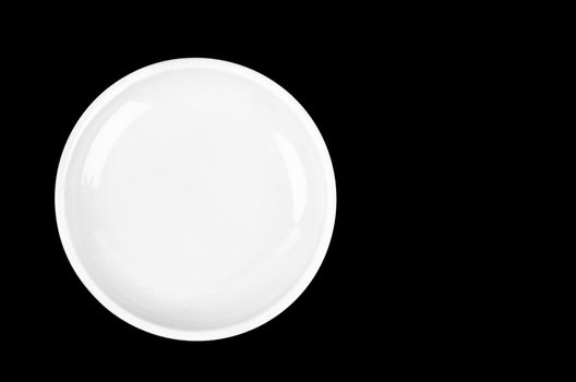 Empty white plate on black background