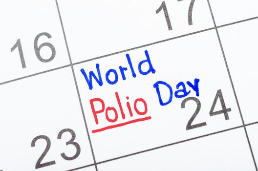 Handwritten World Polio day 24th October marked on a white calendar.