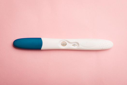 Pregnancy test on a pink background . Positive test. Pregnancy copy space. Motherhood