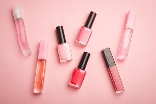 Pink nail polish on a pink copy space background. An article about nail polishes. Gel polish. An article about cosmetics. Decorative cosmetics . Pink background