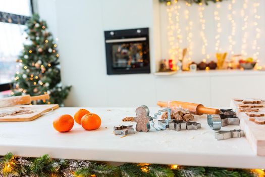 Christmas bakery. Friends making gingerbread, cutting cookies of gingerbread dough, view from above. Festive food, cooking process, family culinary, Christmas and New Year traditions concept