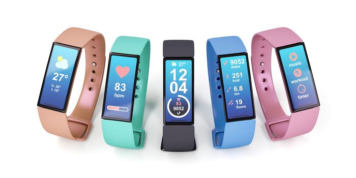 Fitness trackers with different colors on white background