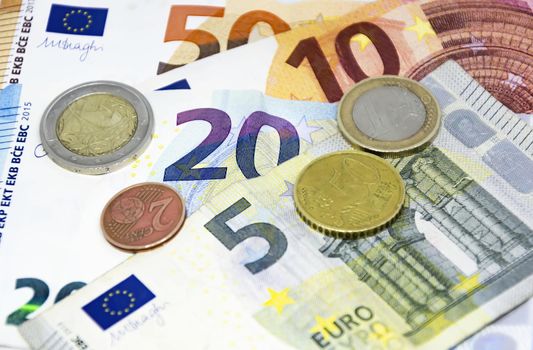 European Union coins and banknotes of different values. The euro is the European currency. Finance, economy and business. Cash and savings