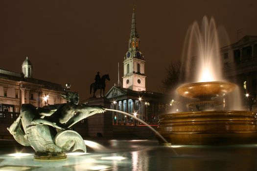 Church of Saint Martin-in-the-Fields and fountains in Trafalgar Square London at night