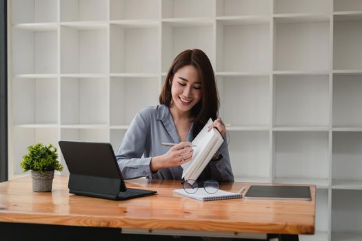 Young asian teacher giving online lessons video conference calling on digital tablet talk by webcam learn teach in online chat, distance webinar online teaching concept.