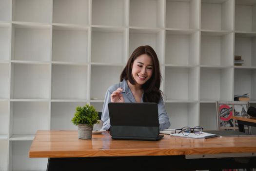 Young asian teacher giving online lessons video conference calling on digital tablet talk by webcam learn teach in online chat, distance webinar online teaching concept.