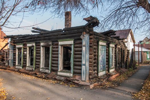 Old wooden house after the fire burned