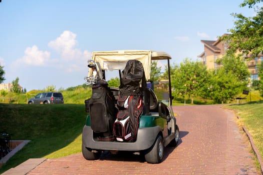 Golf car standing parking golf club Warm summer day Luxury lifestyle concept