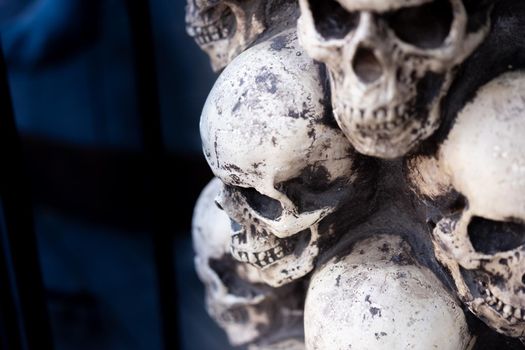 Skull Halloween Background Many People Skulls Stand on top of each other. Mystic creepy concept. Abstract nightmare occult memorial.