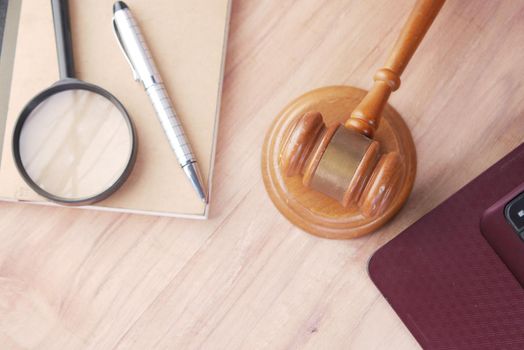 Top view of gavel and book with copy space on table .