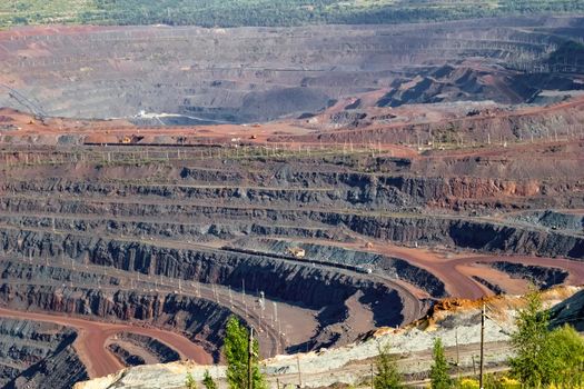 Panorama of an industrial mine for the extraction of natural resources, top view.