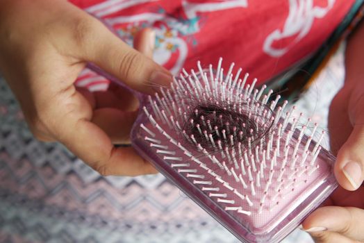 women hold his list hair close up .