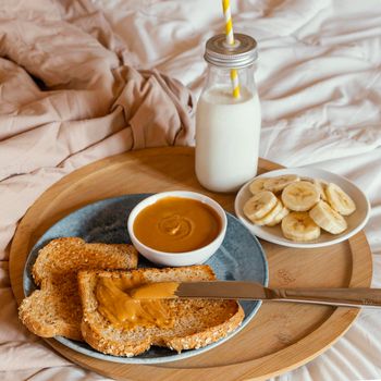 high angle tasty breakfast bed. High resolution photo