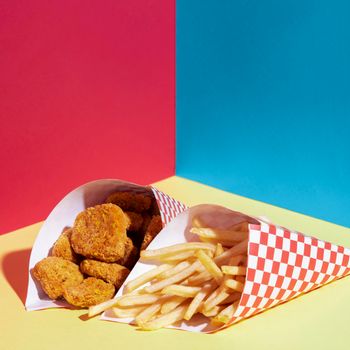 high angle arrangement with fries chicken nuggets. High resolution photo