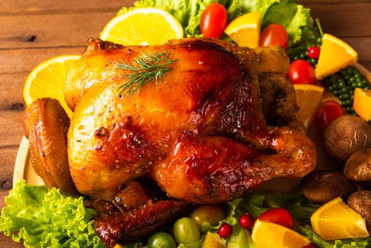 Thanksgiving roasted turkey or chicken and vegetables, Top view Christmas dinner feast food decoration traditional homemade on wooden table background, Happy thanksgiving day of holiday concept