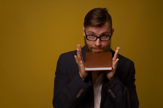 business man with glasses notepad in the hands of a studio official. High quality photo