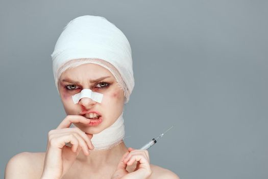 female patient bandaged face health problems isolated background. High quality photo