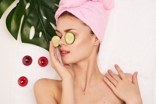 pretty woman naked shoulders cucumber face mask clear skin. High quality photo