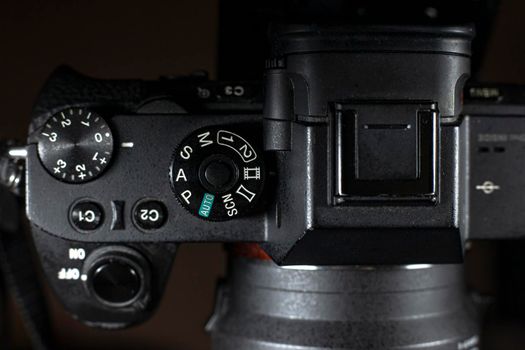 Shutter Speed dial of a digital camera in black background.