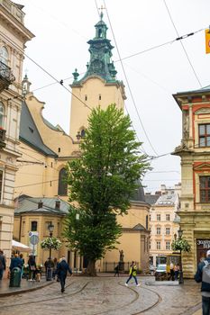 The architecture of buildings on the central square of the city of Lviv. Old Europe. Lviv, Ukraine - 05.15.2019