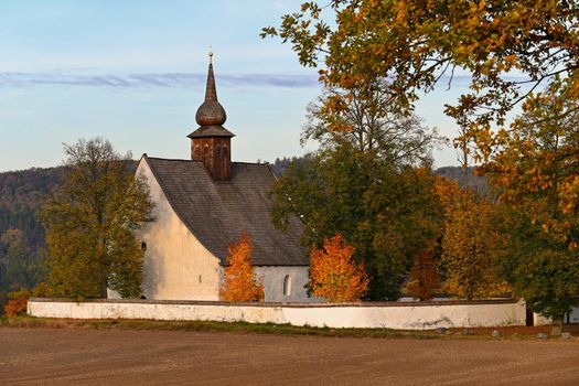 Beautiful autumn landscape with old Chapel of the Mother of God in Veveri. Sunset and beautiful blue sky with clouds. Colorful nature background on autumn season. Brno - Czech Republic.