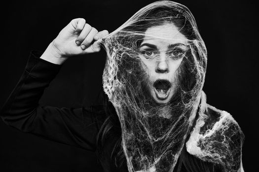 woman in costume holiday fear halloween black background. High quality photo