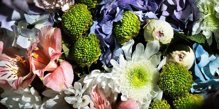 Floral background. Festive bouquet of assorted flowers including blue hydrangea, pink alstroemeria and green green dahlia