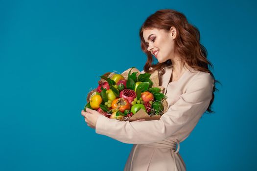 beautiful woman smile posing fruit bouquet vitamins colorful background. High quality photo