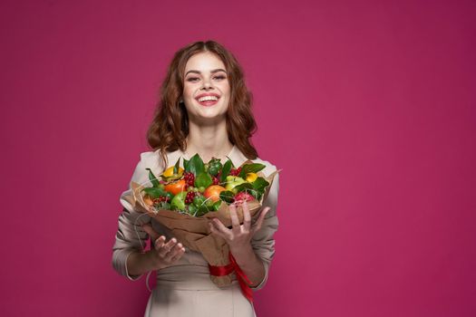 beautiful woman fun posing fruit bouquet vitamins Studio Model. High quality photo