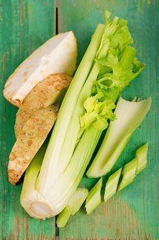 Fresh celery on the old wood background.