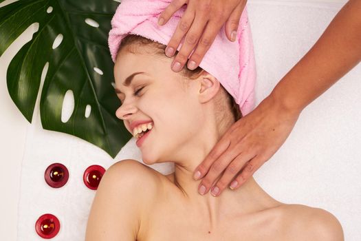 woman with pink towel on her head body care clean skin health. High quality photo