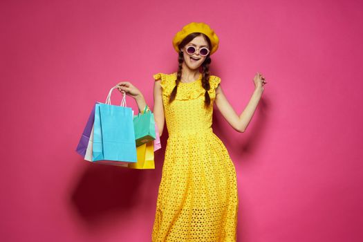 glamorous woman in a yellow hat Shopaholic fashion style isolated background. High quality photo