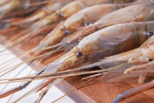 close up of king prawn on plate on table