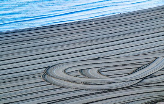 Sand racked texture on the beach in the morning