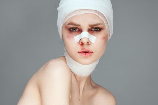 emotional woman plastic surgery operation bare shoulders isolated background. High quality photo
