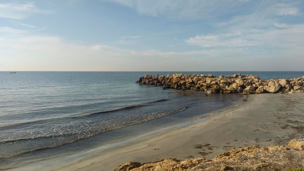 Beach and cloudy sky in the morning in Santa Pola, a small fishing village in southern Spain